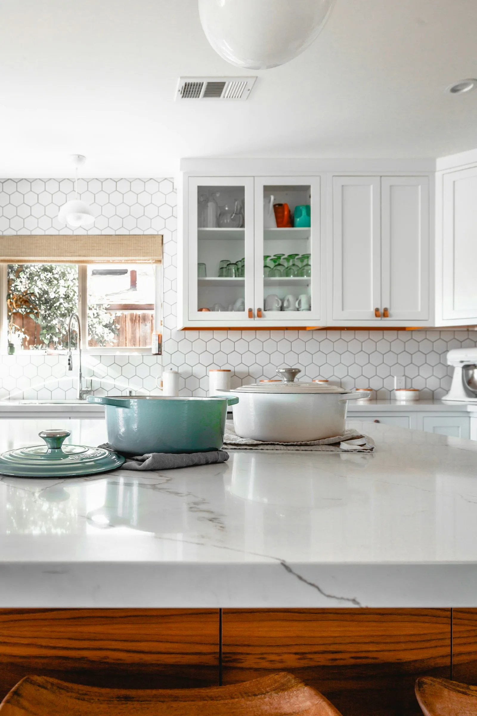 A bright kitchen with a marble island